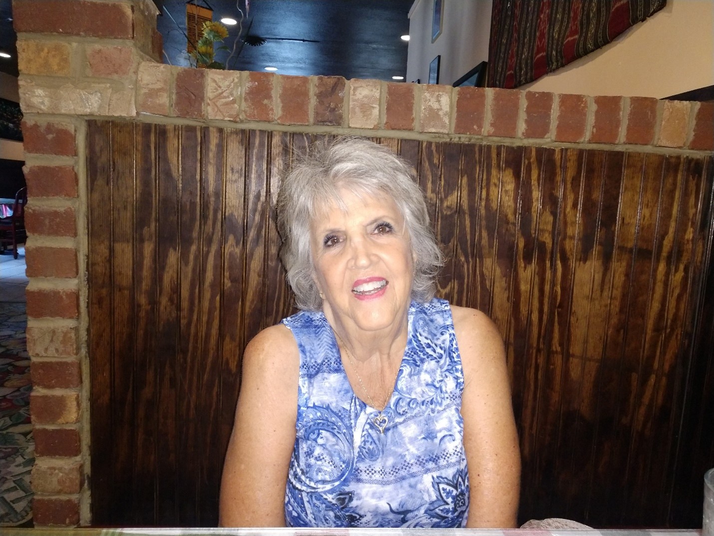 Photo of Barbara seated.