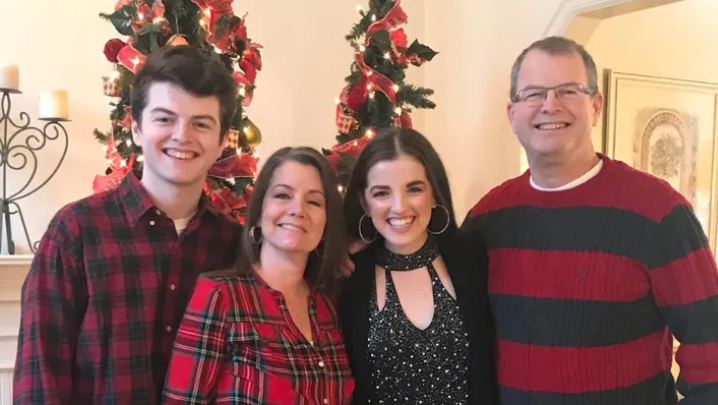 Photo of Brian Tinsley with three family members.